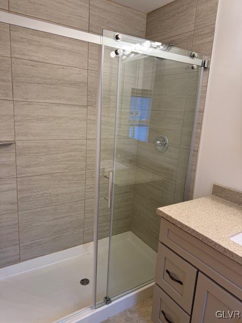 bathroom with vanity and walk in shower