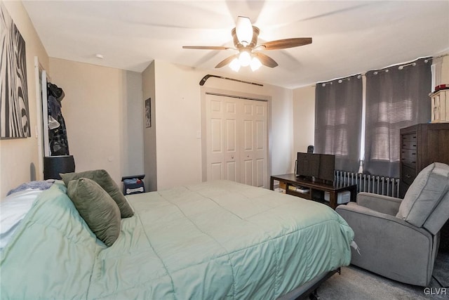 bedroom featuring radiator, ceiling fan, and a closet