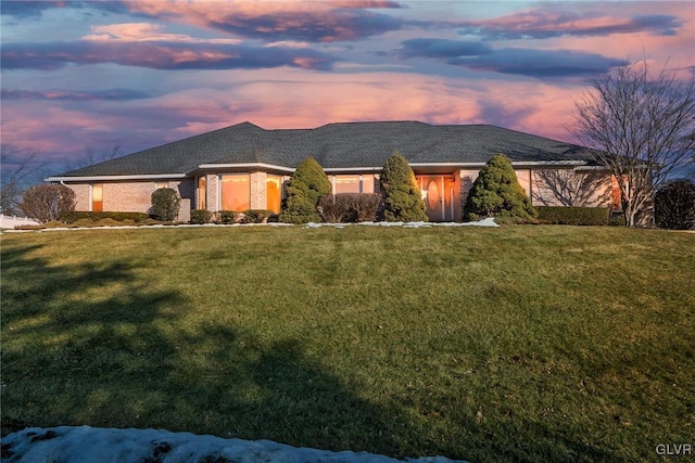 view of front of house with a lawn