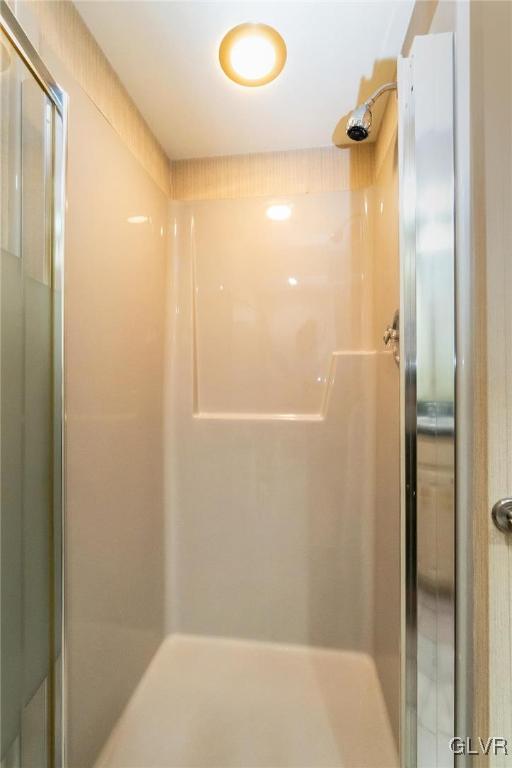 bathroom featuring walk in shower