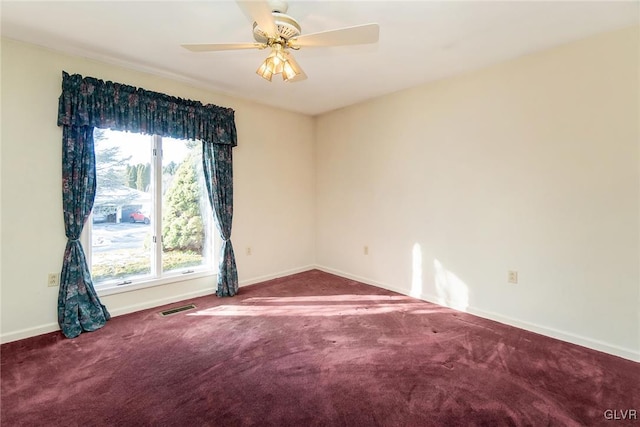 carpeted empty room featuring ceiling fan