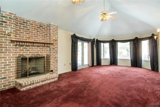 unfurnished living room featuring lofted ceiling, a fireplace, ceiling fan, and carpet flooring