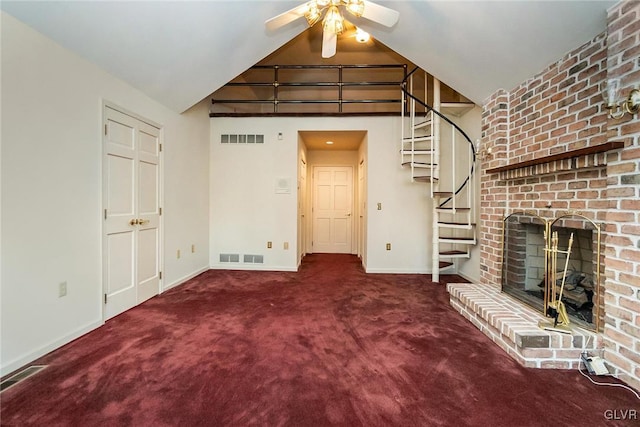 unfurnished living room with ceiling fan, a brick fireplace, high vaulted ceiling, and dark carpet