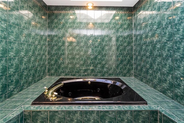 bathroom with tiled tub