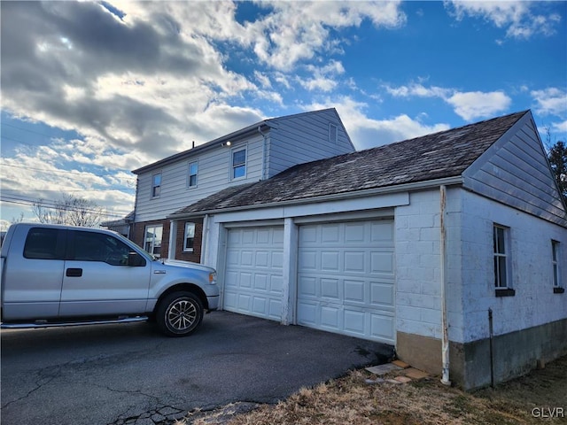 view of property exterior featuring a garage