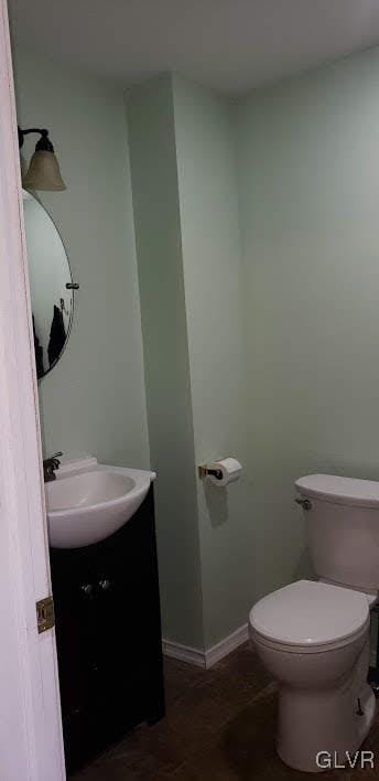 bathroom featuring vanity and toilet