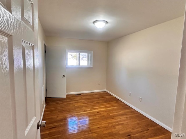 spare room featuring hardwood / wood-style floors