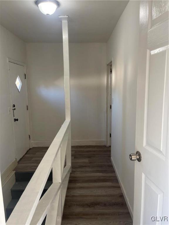 stairway featuring hardwood / wood-style flooring