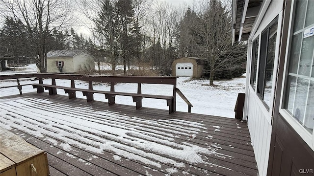 snow covered deck featuring a storage unit