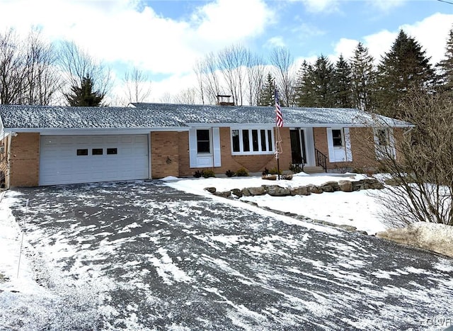 ranch-style house featuring a garage