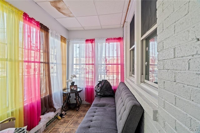 sunroom featuring a drop ceiling