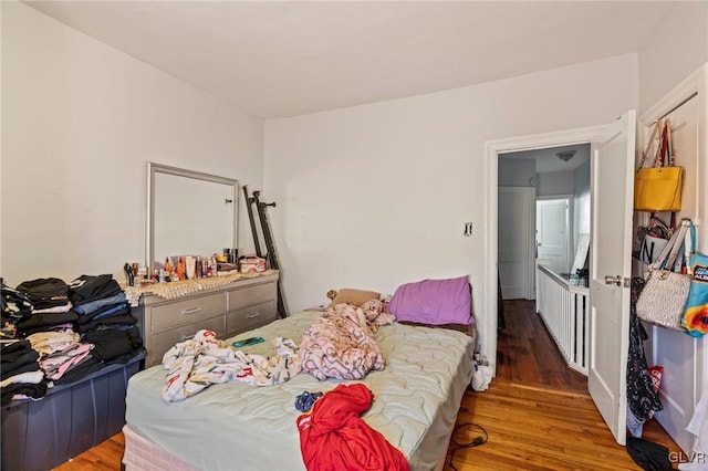 bedroom featuring dark hardwood / wood-style floors