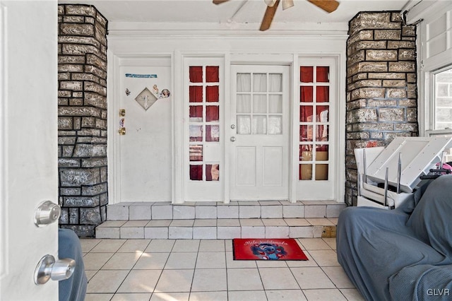 entrance to property featuring ceiling fan