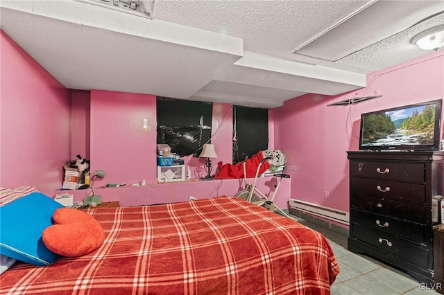 tiled bedroom with a baseboard radiator and a textured ceiling