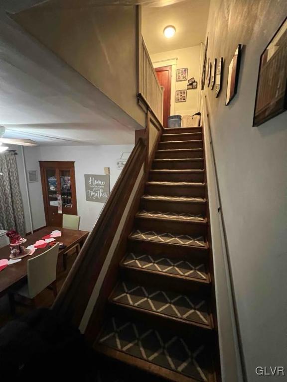 staircase with french doors