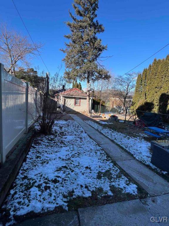 view of yard covered in snow