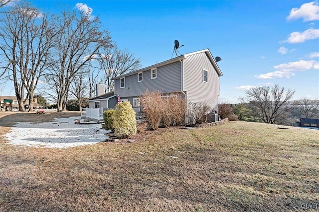 view of property exterior with a lawn