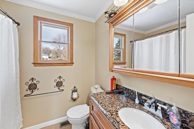 bathroom featuring ornamental molding, vanity, and toilet