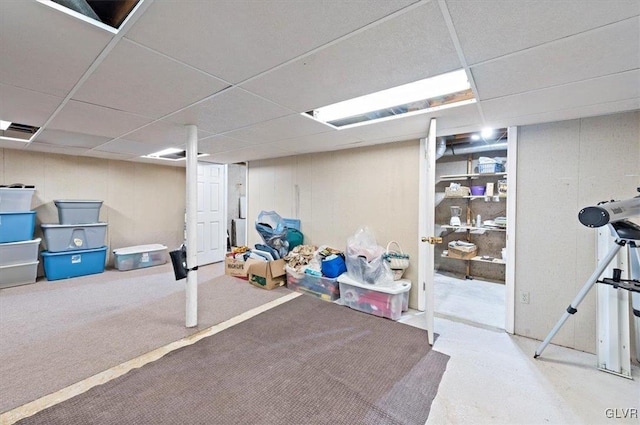 basement featuring a paneled ceiling