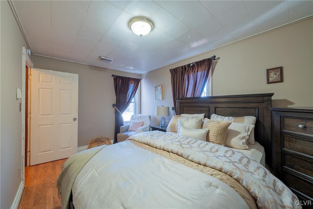 bedroom with light hardwood / wood-style flooring