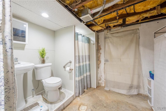 bathroom featuring concrete flooring, walk in shower, and toilet