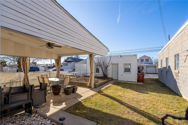 view of patio featuring an outdoor structure and ceiling fan