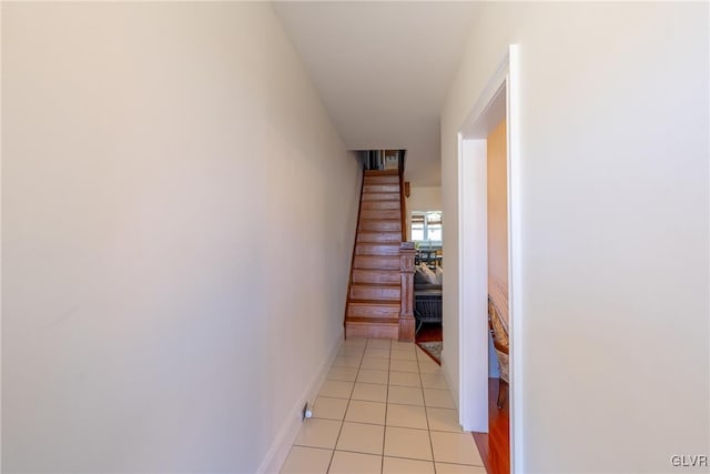 hallway featuring light tile patterned floors