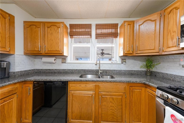 kitchen with tasteful backsplash, tile patterned floors, appliances with stainless steel finishes, and sink