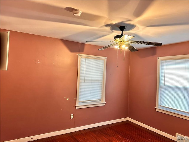 unfurnished room with hardwood / wood-style flooring and ceiling fan