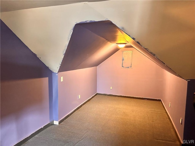 bonus room featuring lofted ceiling and carpet floors