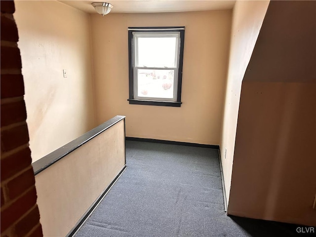 interior space with dark colored carpet