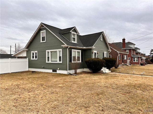 view of side of home featuring a yard