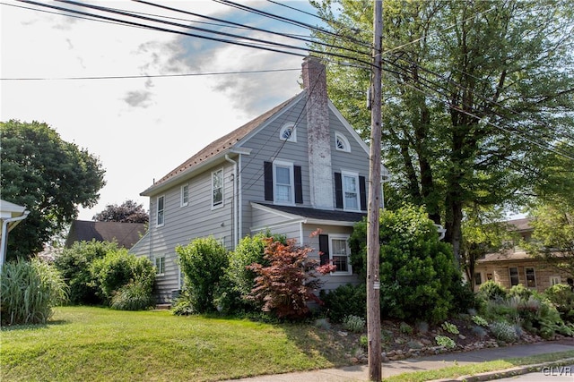 view of home's exterior featuring a yard