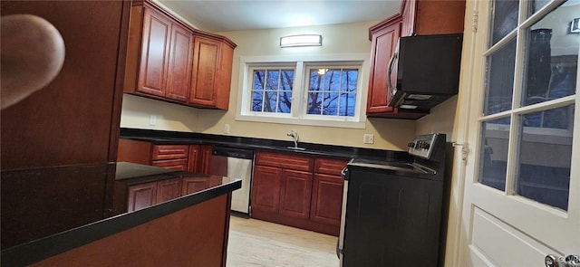 kitchen featuring stainless steel dishwasher and electric range oven