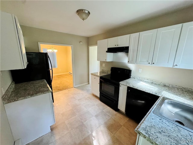 kitchen featuring white cabinetry, a notable chandelier, black appliances, and sink