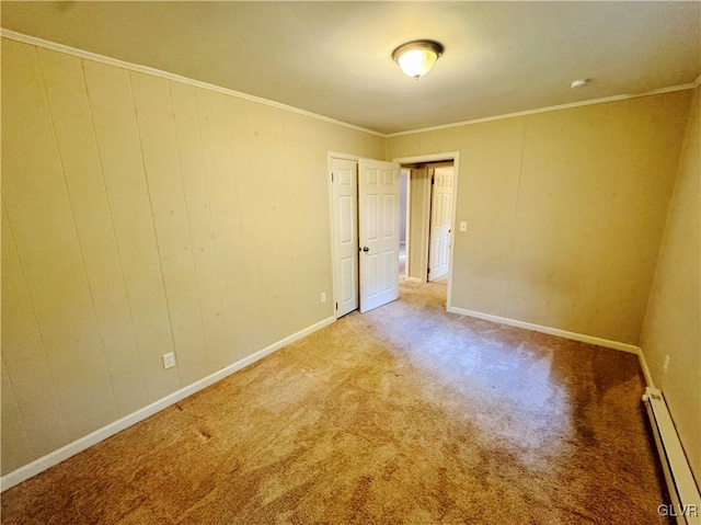 carpeted spare room featuring ornamental molding and baseboard heating