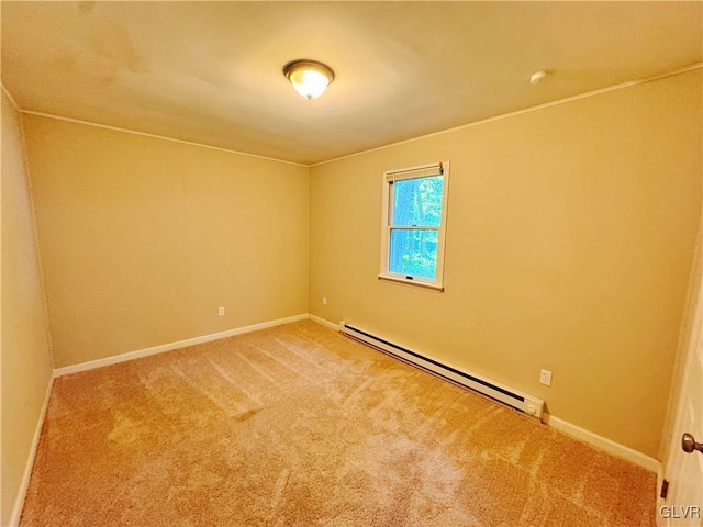 empty room with a baseboard heating unit and carpet flooring