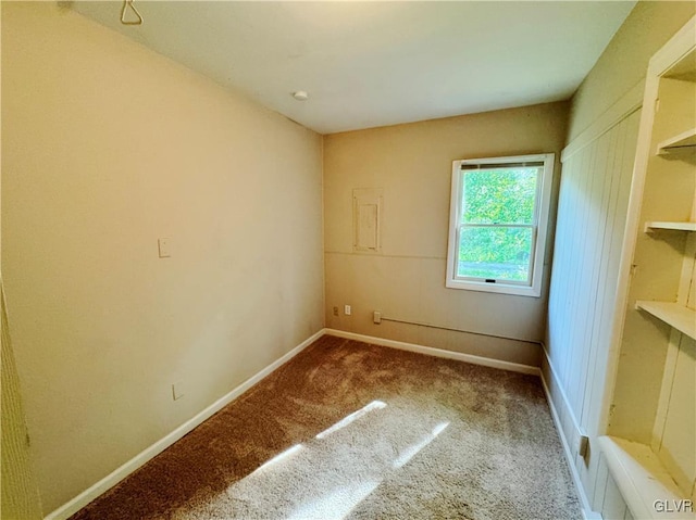 unfurnished room with carpet flooring