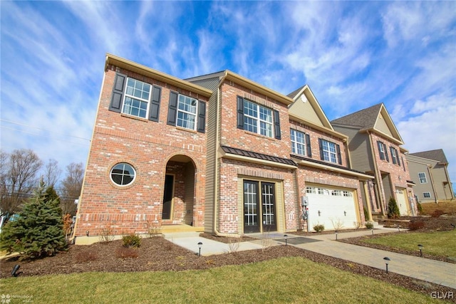 view of front of house featuring a garage and a front yard