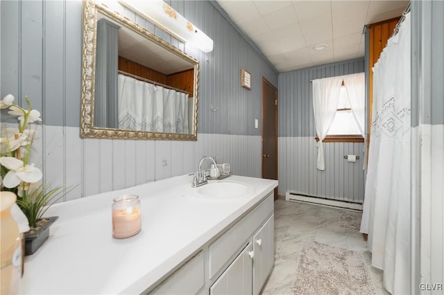 bathroom with vanity and a baseboard radiator