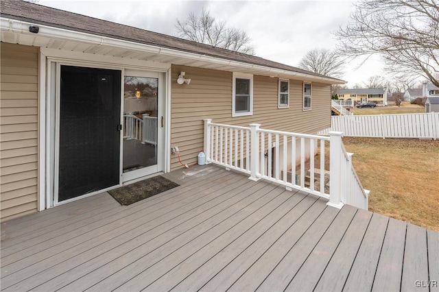 wooden deck with a lawn