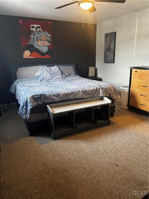 carpeted bedroom with ceiling fan