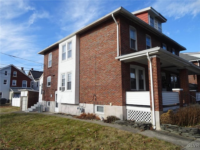 view of property exterior featuring a lawn