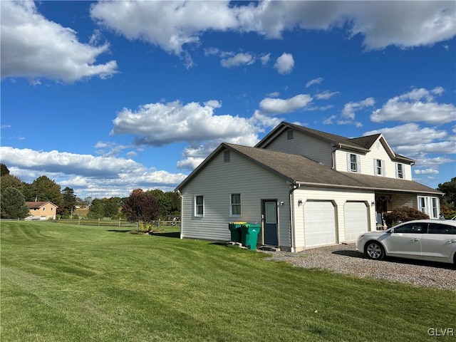 view of property exterior with a yard and a garage