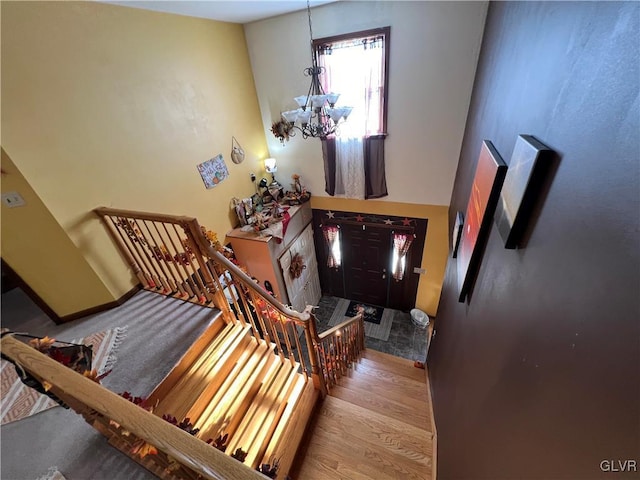 foyer entrance featuring an inviting chandelier and light hardwood / wood-style flooring