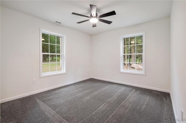 empty room featuring ceiling fan and carpet flooring