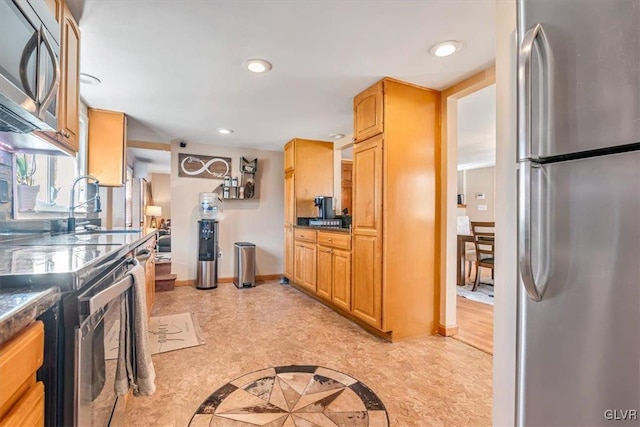 kitchen featuring appliances with stainless steel finishes and sink