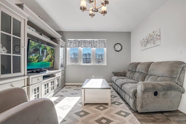 living room with an inviting chandelier and hardwood / wood-style floors