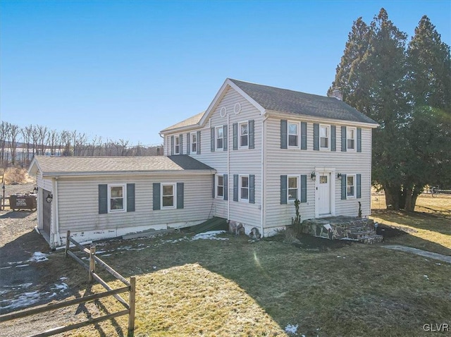 colonial inspired home with a front yard