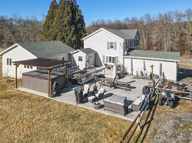 rear view of house featuring a yard, outdoor lounge area, a pergola, and a patio area